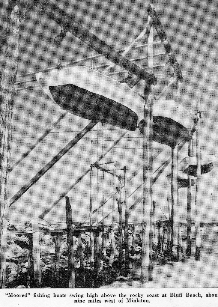 Moored fishing boats swing high above the rocky coast at Bluff Beach, about 9 miles west of Minlaton